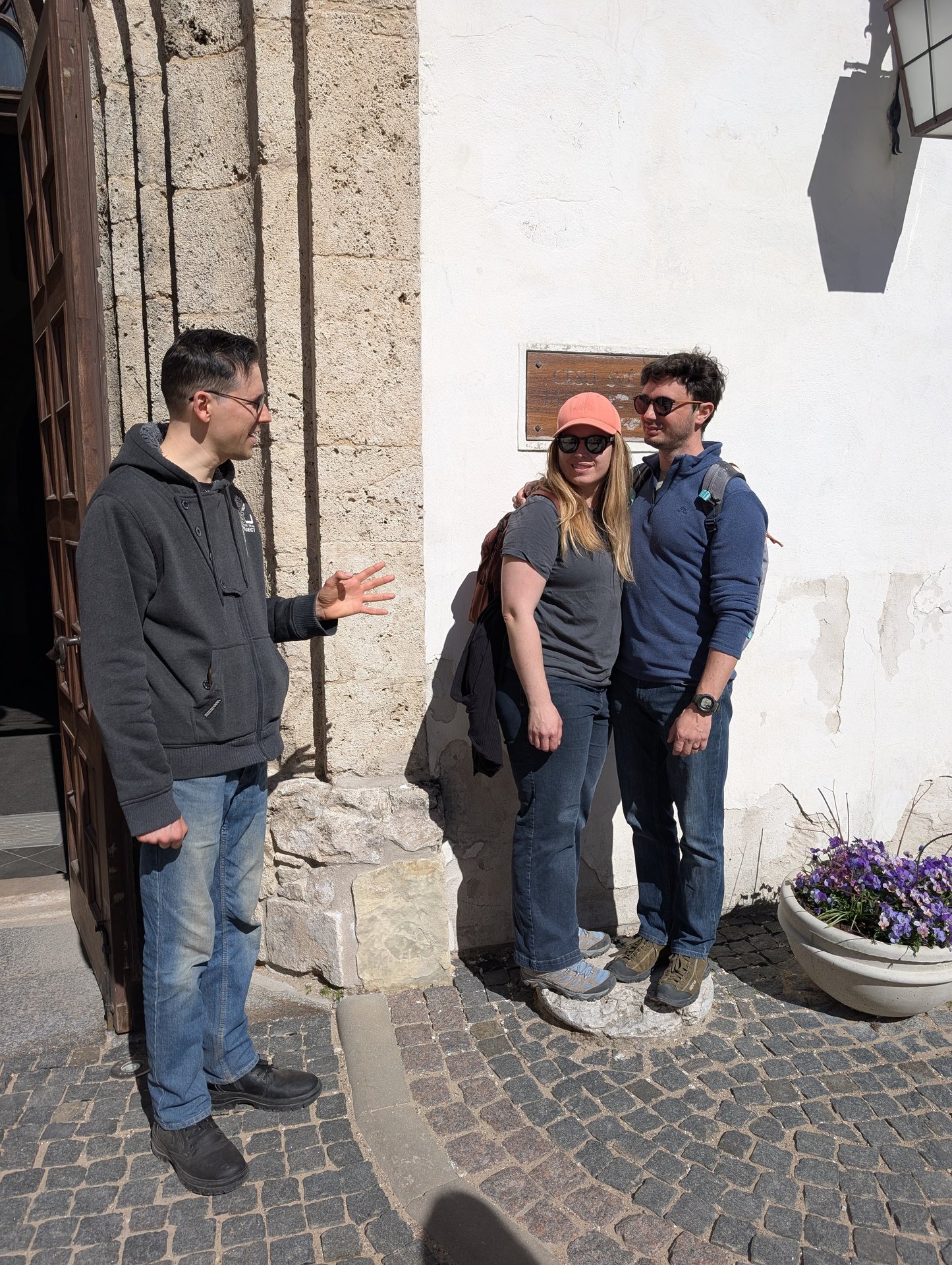 Guide explaining at a stop on the Cēsis old-town walking tour