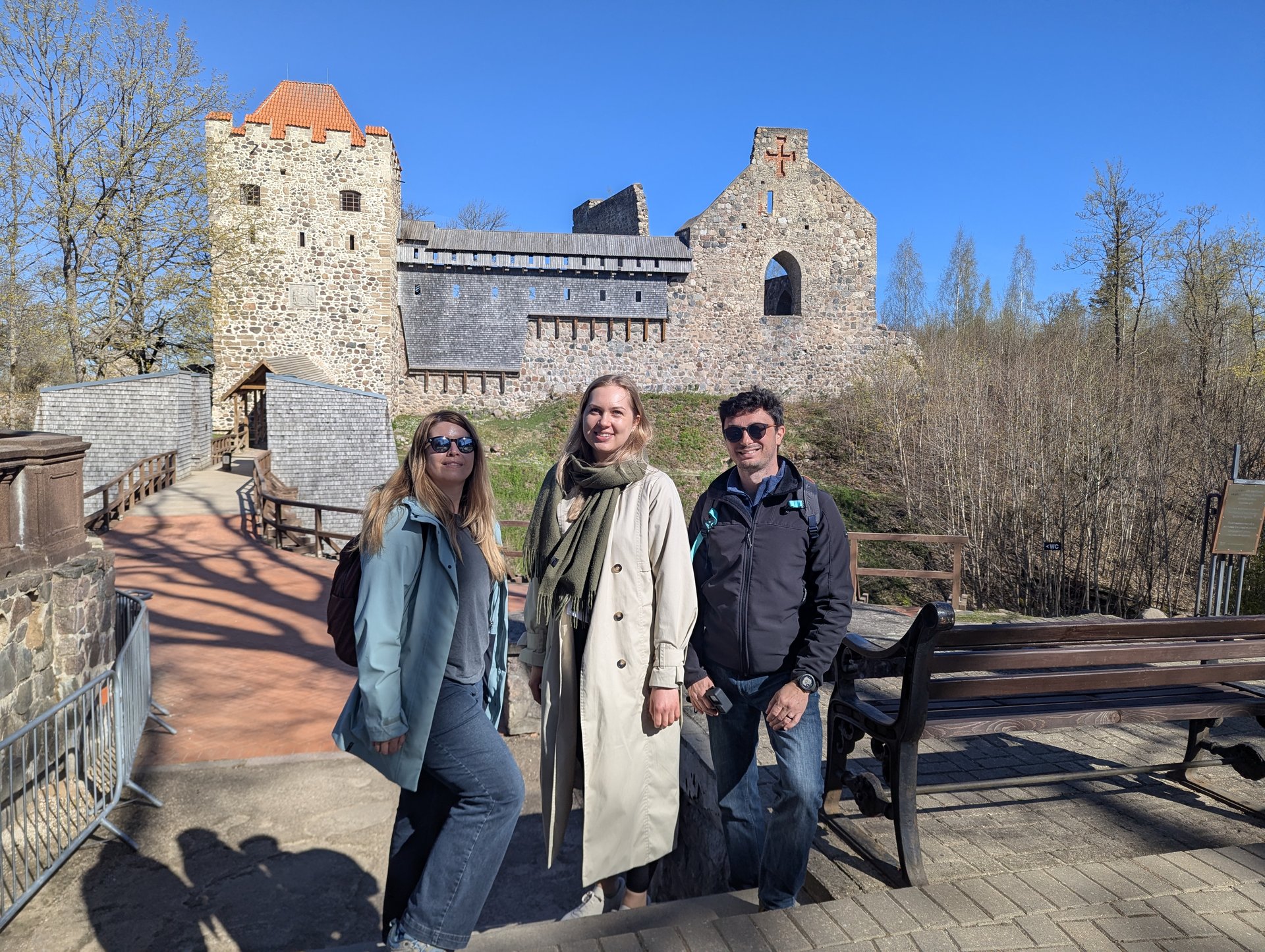 Guests in front of the Sigulda Medieval Castle ruins