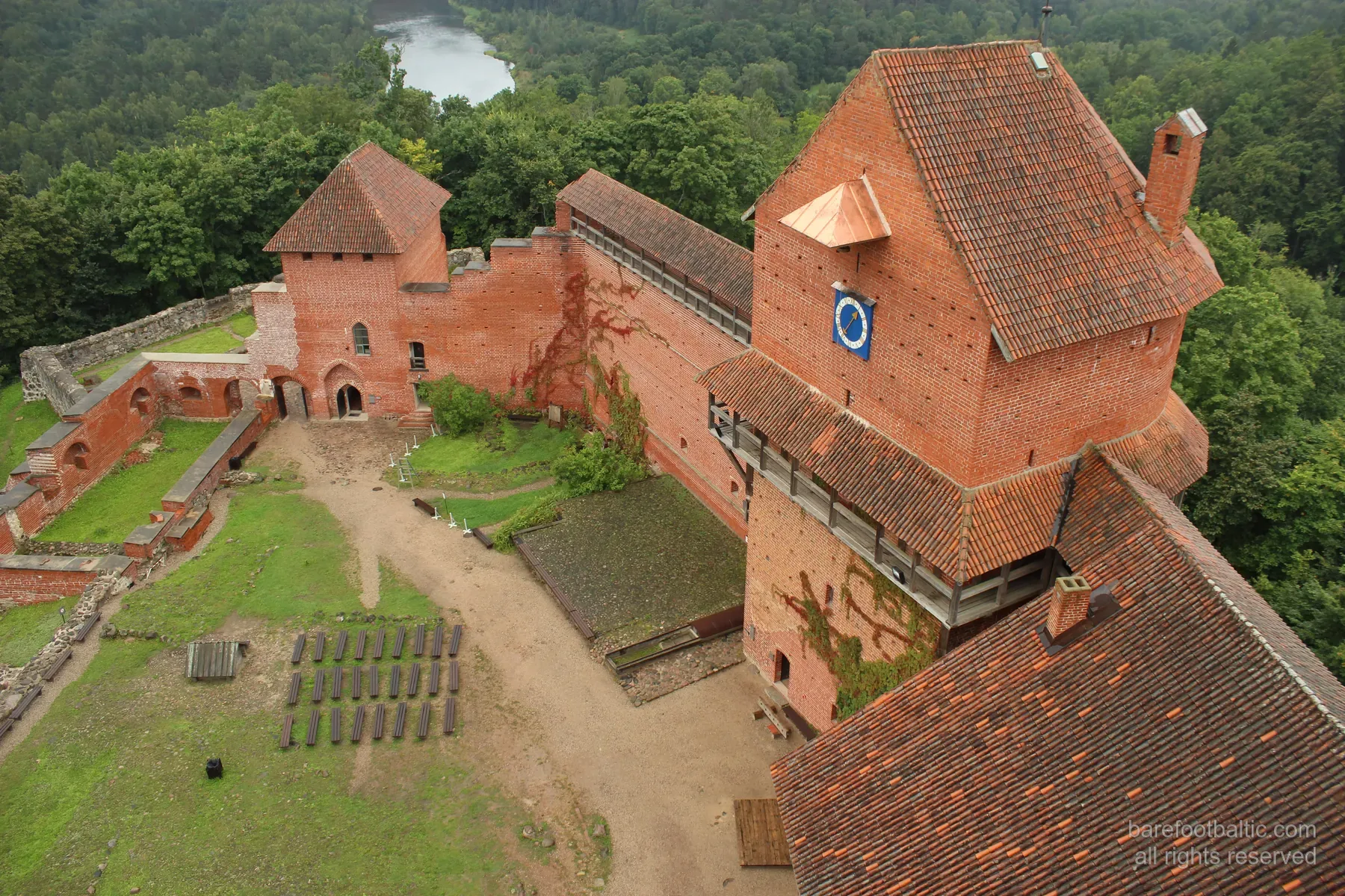 Aerial view of red-brick Turaida Castle on the hillside above the Gauja Valley, Sigulda, Latvia