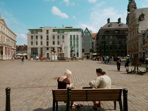 Town Hall Square Sitting People in Riga