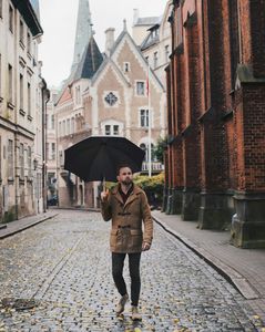 Umbrella Street Person Walking Concrete Cobblestone in Riga