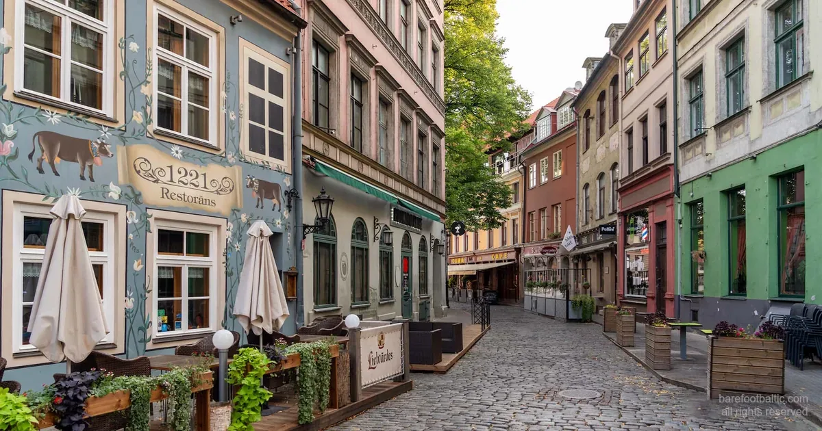 Cobblestone street with restaurants in Riga Old Town, Latvia.