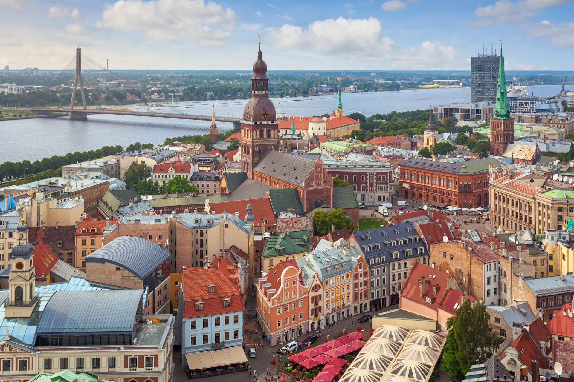 Aerial view of Riga Old Town and the Daugava river at golden hour &mdash; opening evening of the 9-day Latvia immersion tour